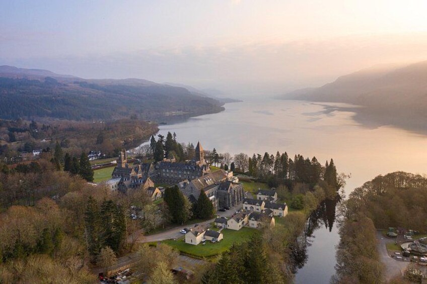 A lakeside town with historic buildings, a church, and a river. 4