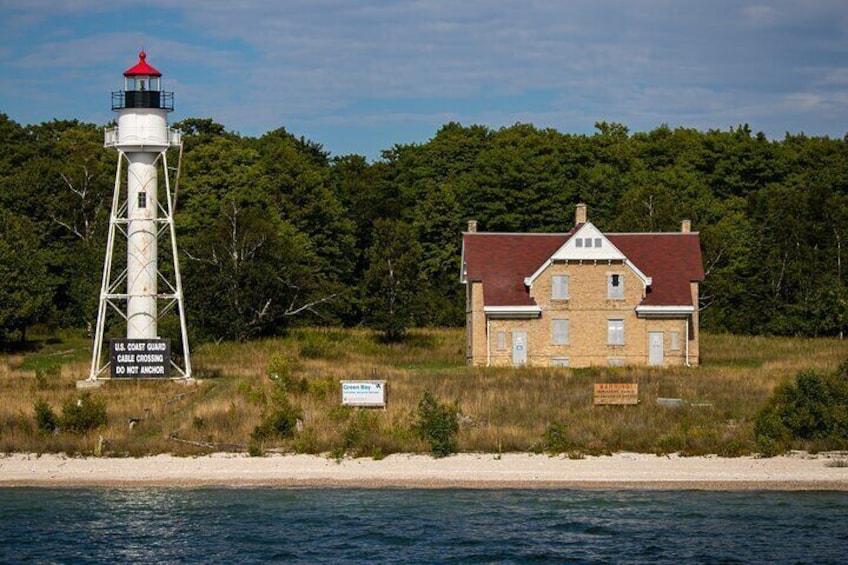 A lighthouse, a house, and a beach. 3