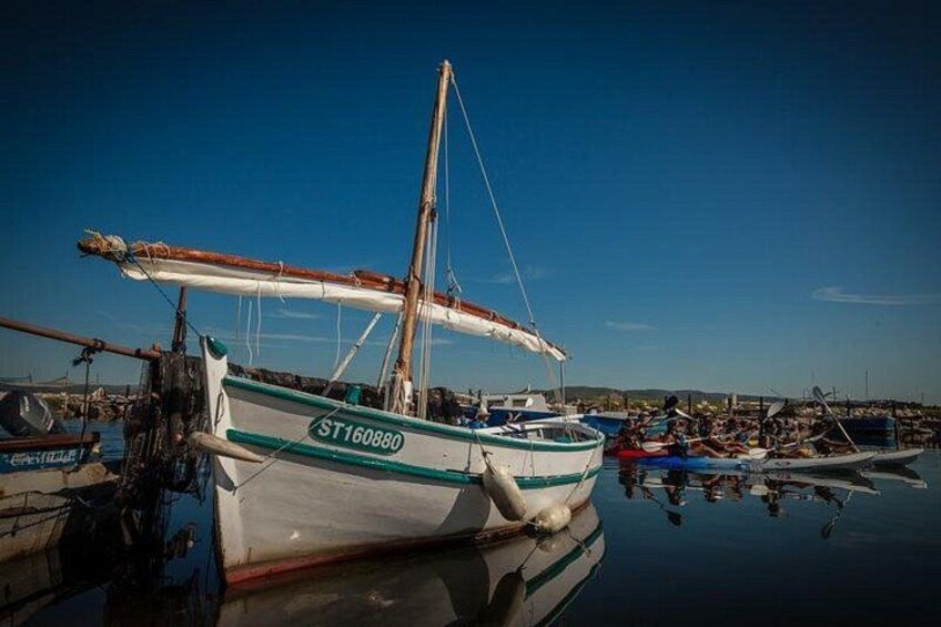 A boat with the registration ST160880 docked at a marina. 5