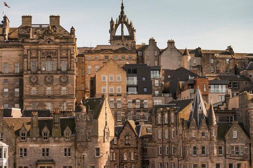 A historic cityscape with Gothic architecture, including pointed spires and ornate facades. 4