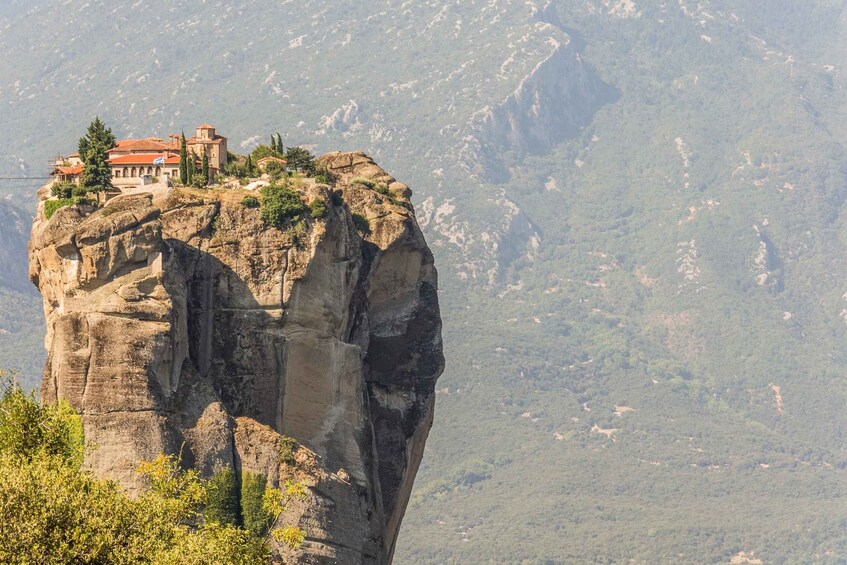A monastery perched atop a rocky cliff. 5