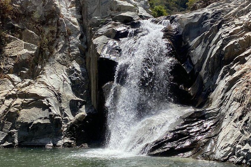 A waterfall cascading over rocky terrain. 4