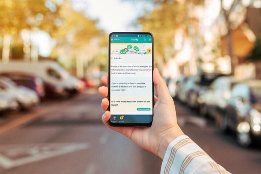 A hand holding a smartphone displaying a travel app with a map and text. 3