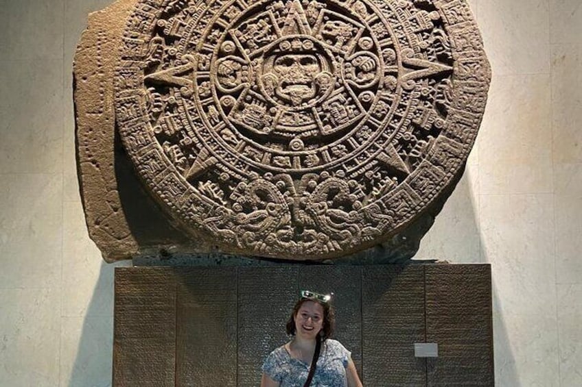 A large stone carving with intricate designs and symbols. 2