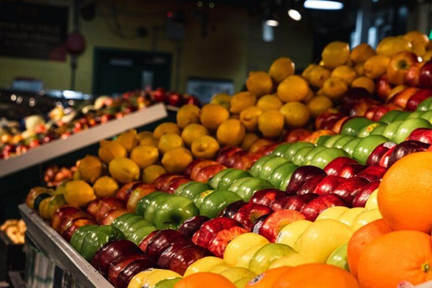A grocery store with various fruits and vegetables on display. 4