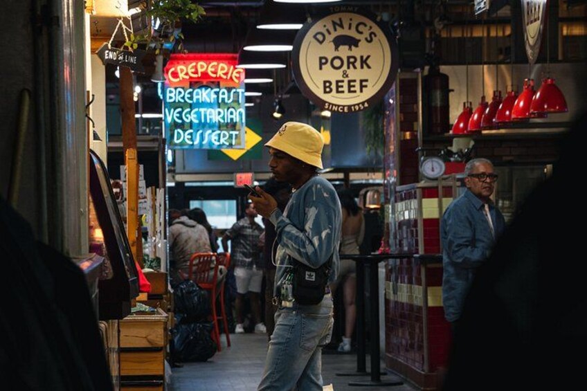A street scene with a restaurant named 'Dinic's Pork & Beef' and a sign for 'Creperie Breakfast Vegetarian Dessert.' 5