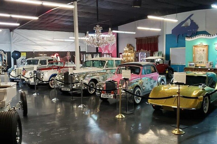 A vintage car exhibition with various classic cars on display. 1