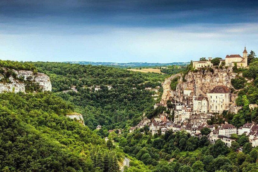 A castle on a cliff overlooking a valley. 3