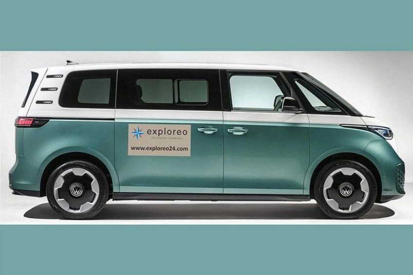 A teal-colored minivan with the logo 'exploreo' and website 'www.exploreo24.com' on its side. 2