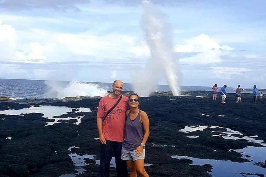 A volcanic landscape with lava flows and steam vents. 1