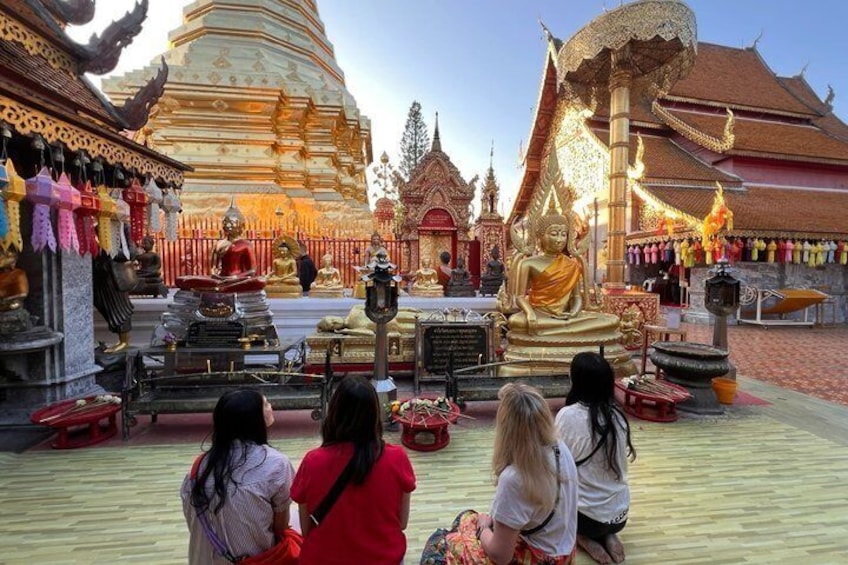 A temple with golden statues and intricate architecture. 2