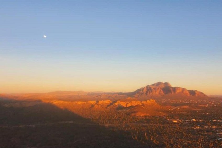A mountain range during sunset with a clear sky. 2