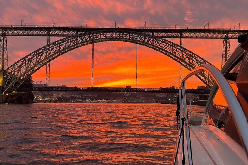 A bridge over water during sunset. 4