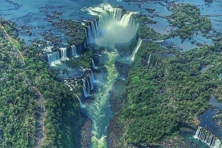 A waterfall cascading through a forested area with multiple water channels. 3