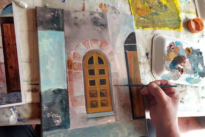 A person painting a window on a textured wall. 3