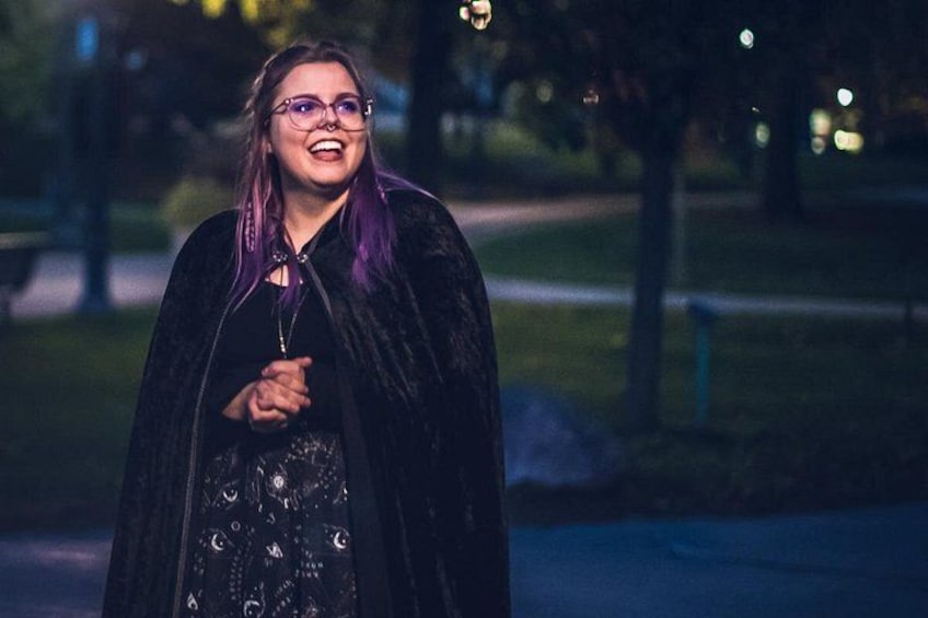 A person walking in a park at night. 1