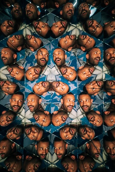 A geometric pattern with repeated images of a person. 3