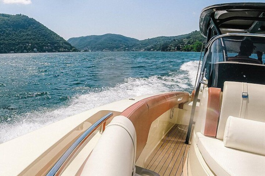 A boat on water with a view of hills in the background. 3