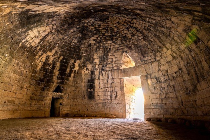 An underground chamber with a domed ceiling and a small opening leading to the outside. 2