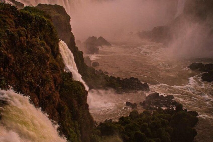 A waterfall cascading over a rocky cliff. 5