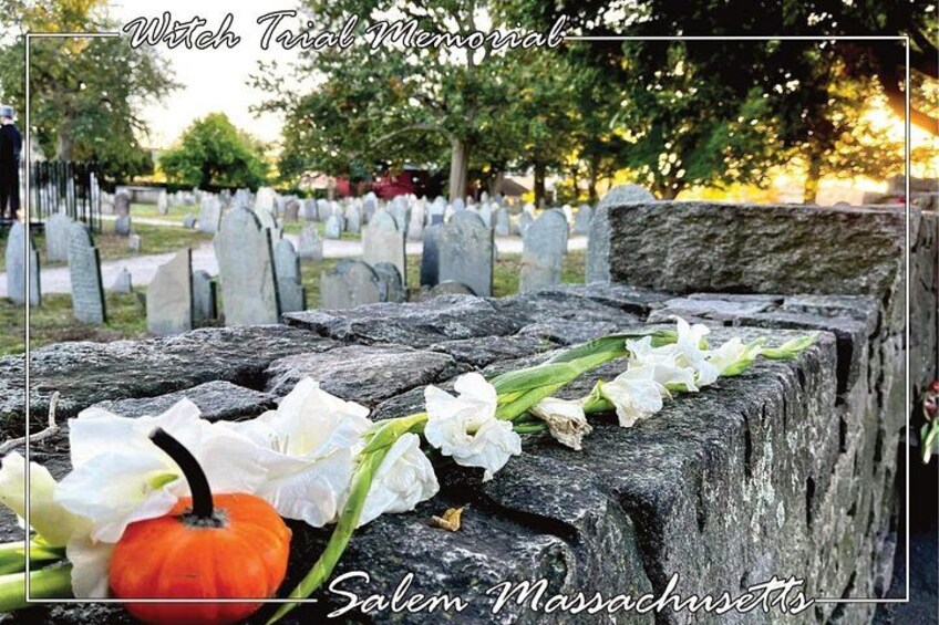 A cemetery with headstones and a pumpkin. 4