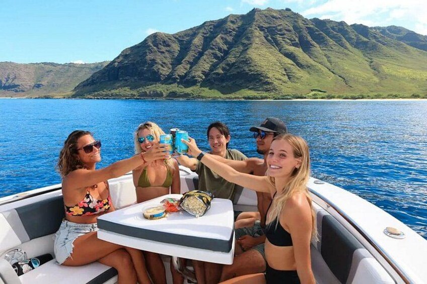 A group of people on a boat with a mountainous landscape in the background. 4