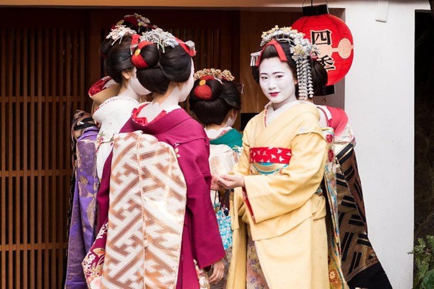 Geisha in traditional attire, wooden shoji screens, and a red lantern. 2