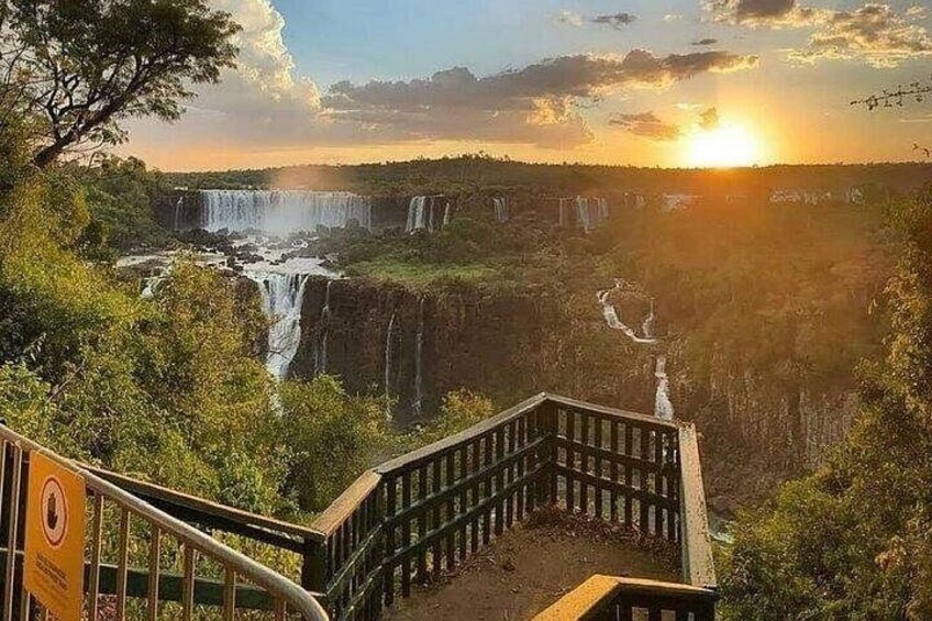 A waterfall, a wooden staircase, and a sunset. 4
