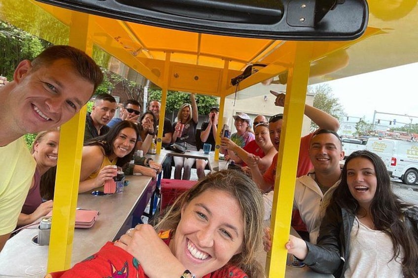 A group of people sitting inside a yellow bus. 4