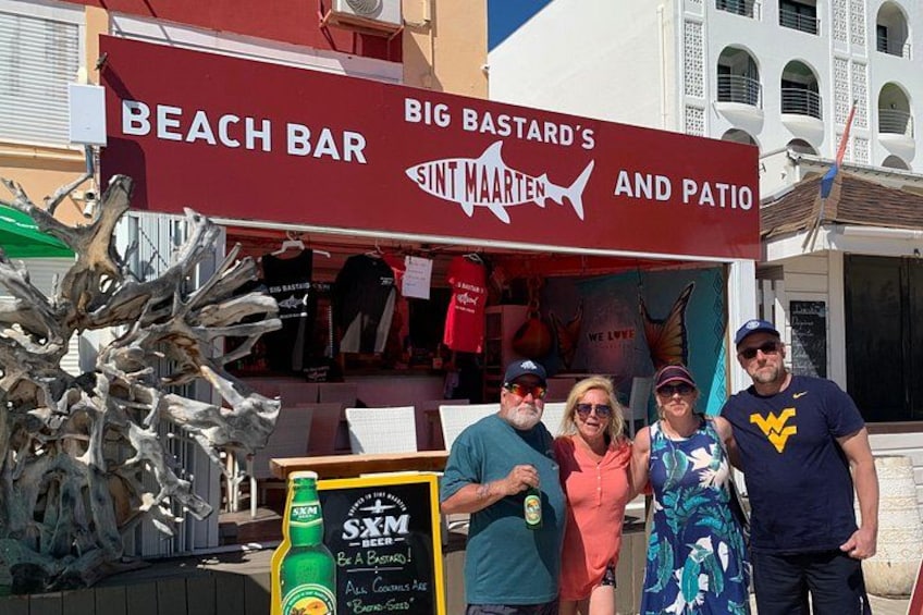A beach bar with a sign reading 'BIG BASTARD'S SINT MAARTEN AND PATIO'. 5