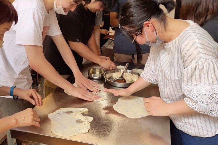 Japanese Student having fun with roti Canai Dough 1