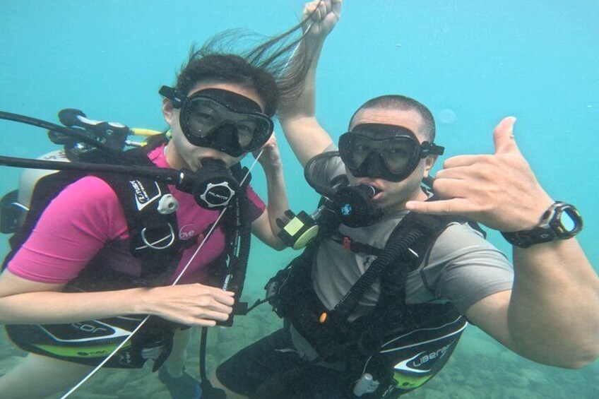 Two people scuba diving underwater. 5