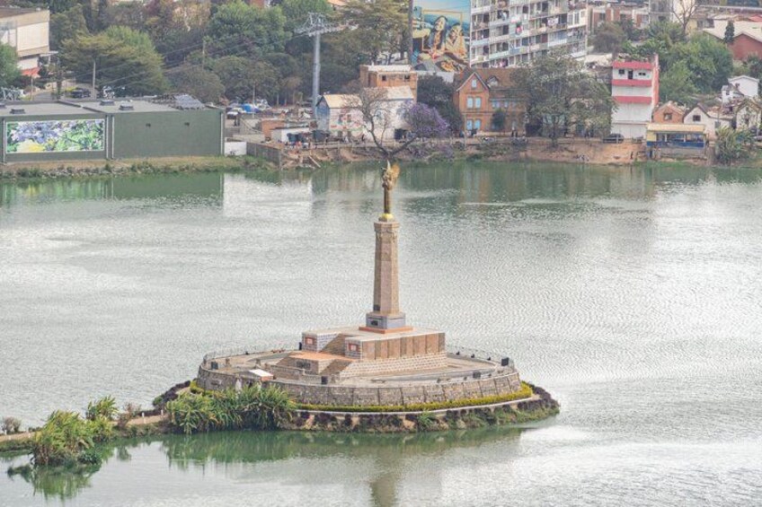 A large, circular island with a central tower surrounded by water. 3