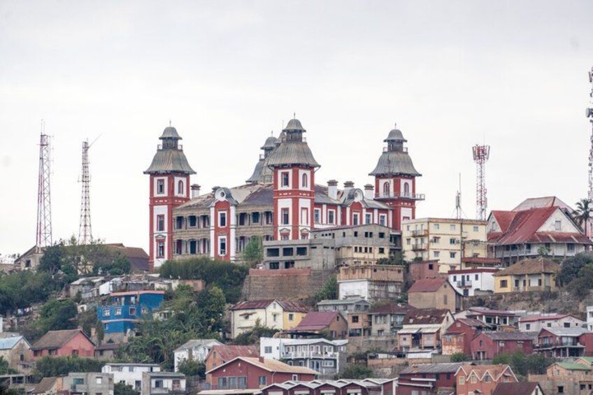 A historic building with multiple domes and towers, surrounded by residential buildings. 5