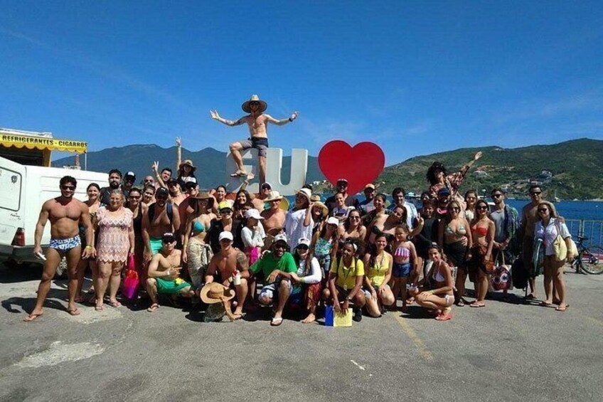 Tourists at the sign "I ♥ Arraial do Cabo 3