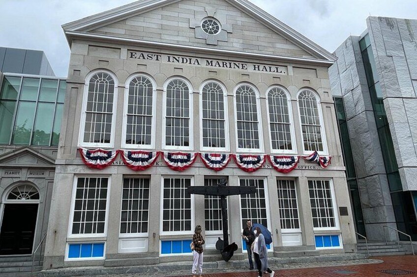 The East India Marine Hall with large arched windows and a prominent clock. 3