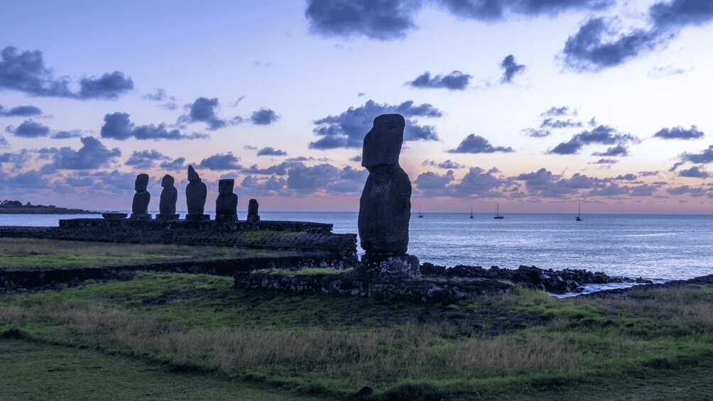A row of Moai statues on Easter Island at sunset. 2