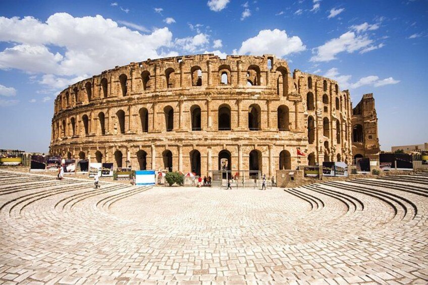 The Colosseum in Rome with its iconic arches and circular layout. 3
