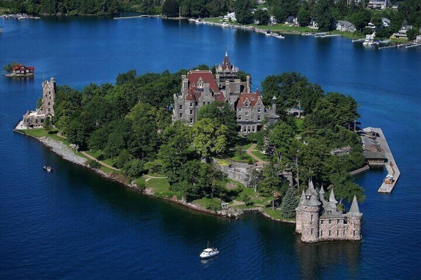 An island with a castle surrounded by water. 3