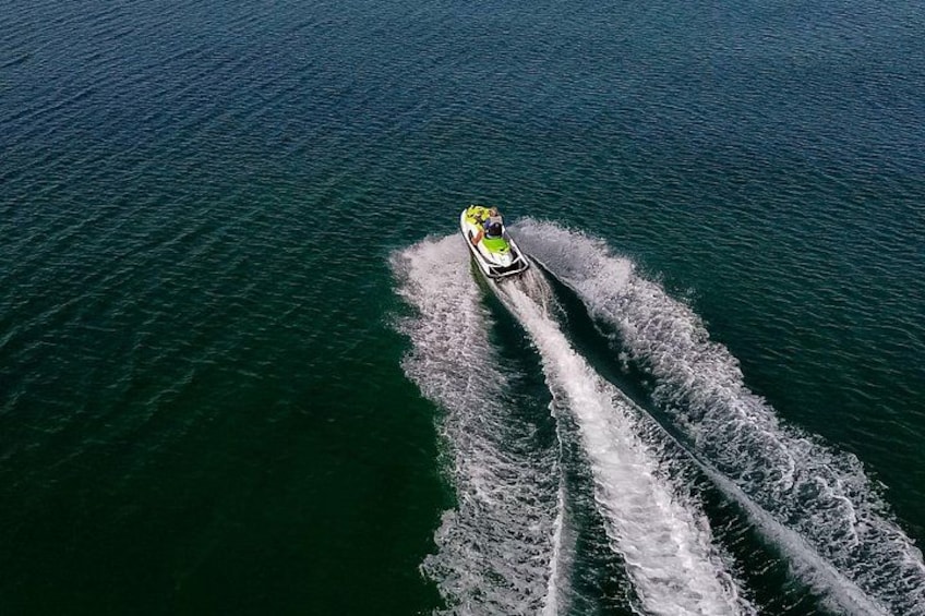A jet ski creating a wake in the water. 2