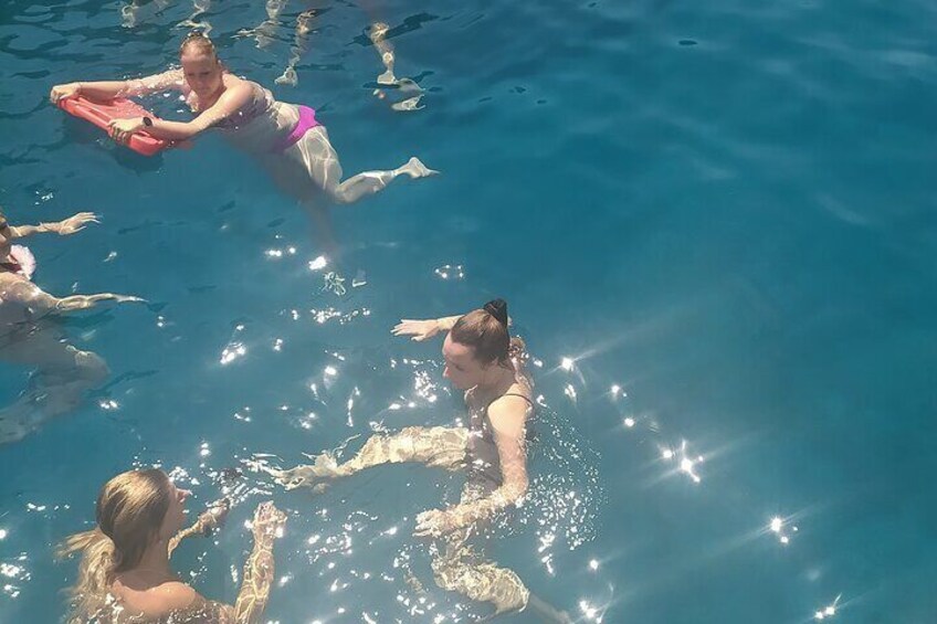 People swimming in a pool. 1