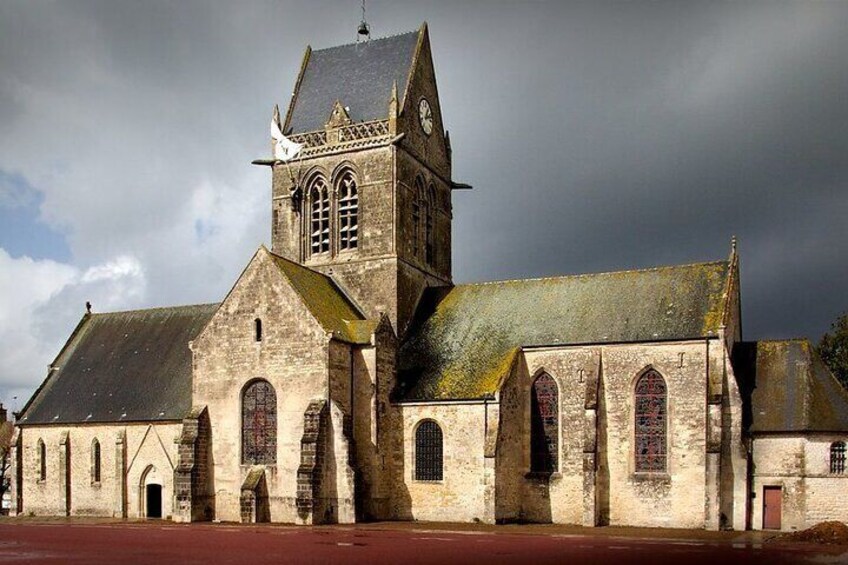 A historic church with a prominent bell tower and arched windows. 3