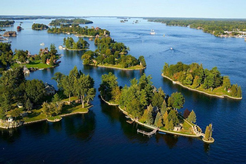A lake with multiple islands, surrounded by greenery and residential areas. 2