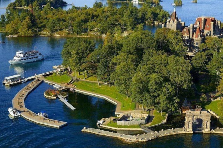 A lake with a castle, a dock, and a boat. 2