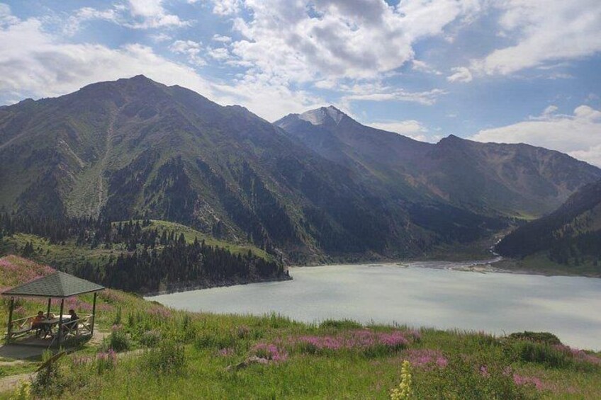 A mountain landscape with a lake and a small pavilion. 3