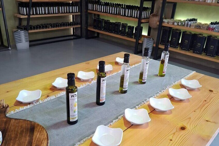A tasting table with bottles of wine and empty white bowls. 3