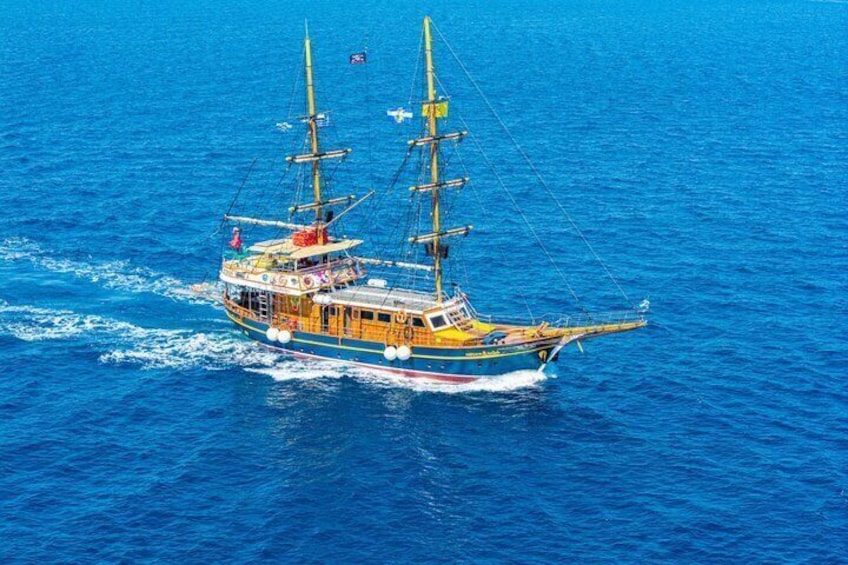 A large, colorful sailing ship on the ocean. 5