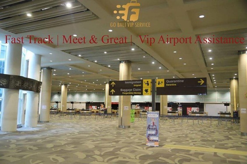 A spacious airport terminal with directional signs for immigration, quarantine, and baggage claim. 3