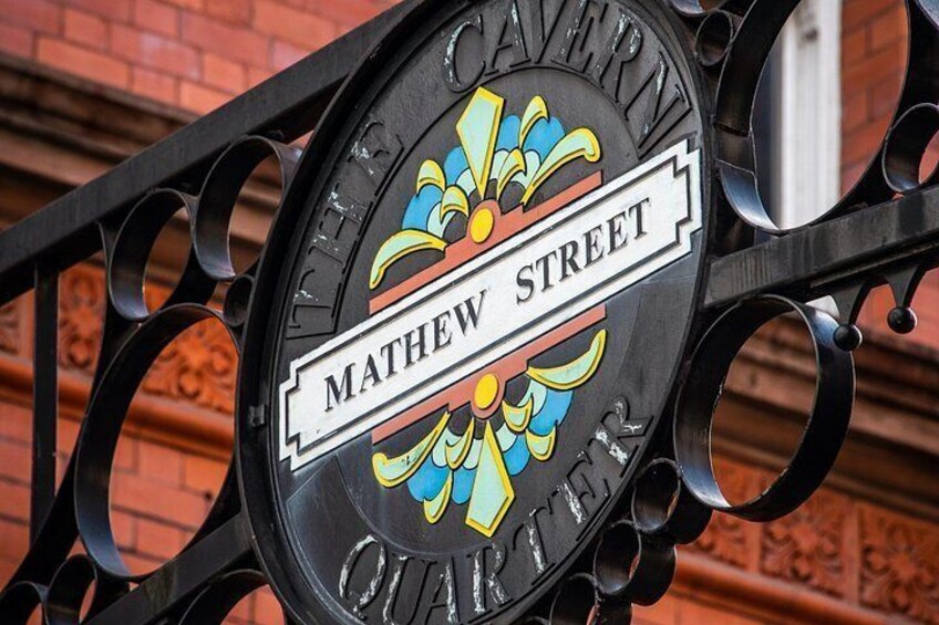 A street sign with 'Mathew Street' and 'Theatre Quarter' on it. 3