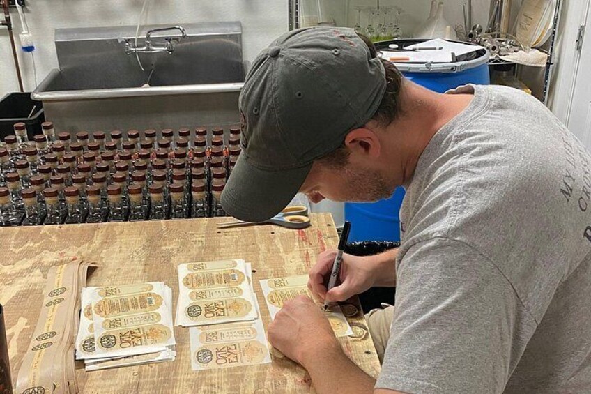 Rick one of the founders hand writes on every label of spirit we craft in house 4